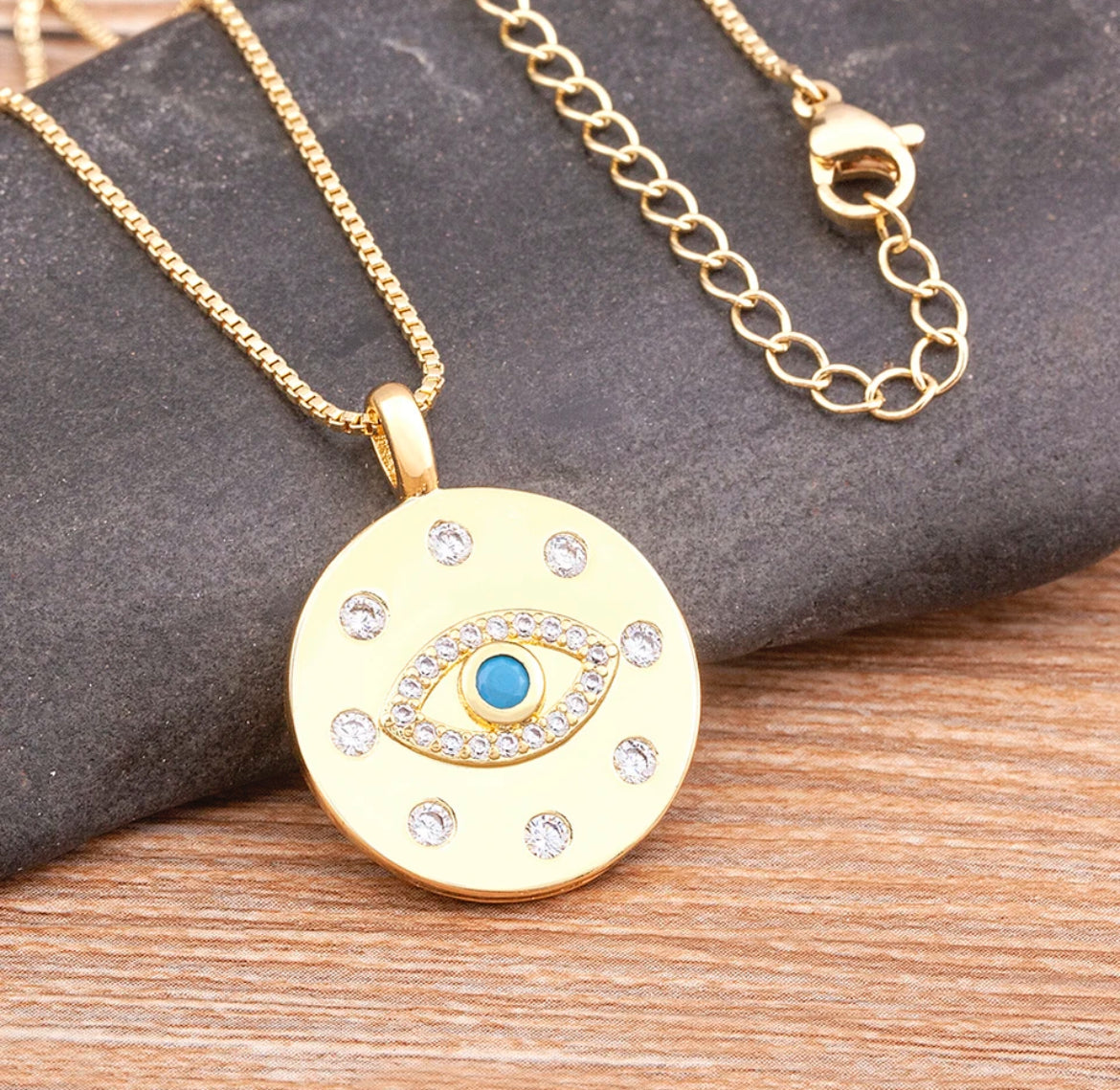 Light blue and gold eye pendant